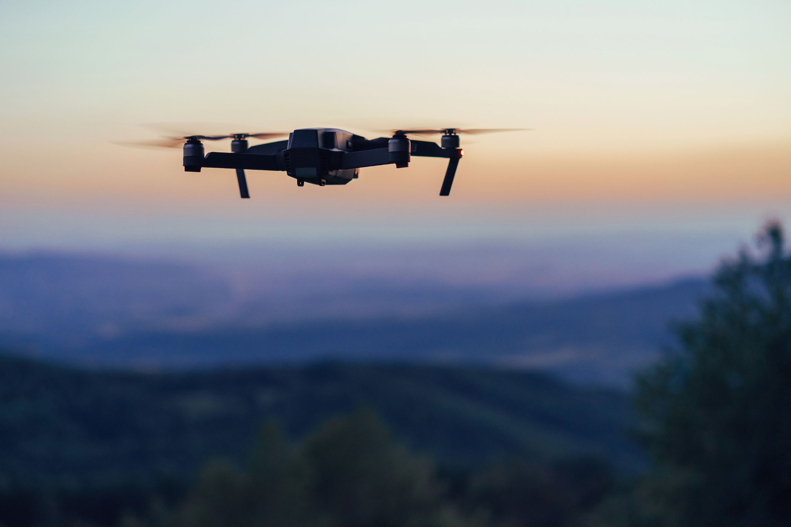 Unmanned aerial vehicle (drone) flying outdoors
